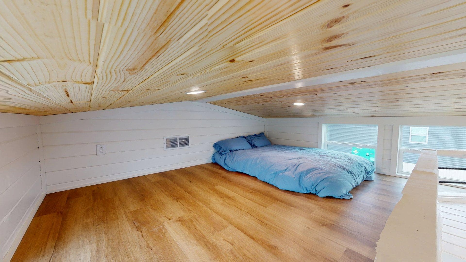 The blue wing bedroom home features